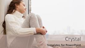  Presentation with sadness - Cool new theme with childhood sadness and people concept - sad beautiful girl in sweater sitting on sill at home window in winter backdrop and a mint green colored foreground