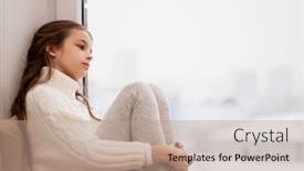  Presentation with sadness - Colorful theme enhanced with childhood sadness and people concept - sad beautiful girl in sweater sitting on sill at home window in winter backdrop and a coral colored foreground