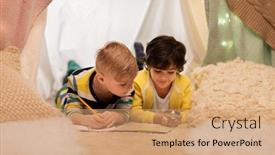  Presentation with kids travel - Amazing presentation having childhood travel and hygge concept - happy little boys with magnifier and road map searching location in kids tent at home backdrop and a coral colored foreground