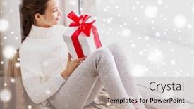  Presentation with christmas girl - Theme featuring childhood winter holidays and people concept - happy beautiful girl with christmas gift sitting on sill at home window background and a light gray colored foreground