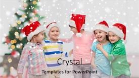  Presentation with snow tree - Beautiful slides featuring childhood winter holidays friendship and people concept - group of happy smiling little children in santa hats hugging over christmas tree and snow backdrop and a soft green colored foreground
