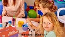  Presentation with children painting - Beautiful slide deck featuring children with young woman painting on paper at table in kindergarten backdrop and a coral colored foreground