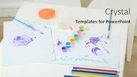  Presentation with childrens - PPT theme consisting of childrens creativity on the table with paints brushes and colored pencils background and a light gray colored foreground