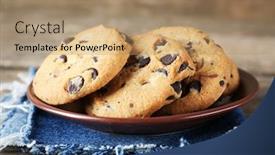  Presentation with chocolate chip cookies - Presentation featuring chocolate chip cookies on jeans napkin on wooden table background and a coral colored foreground