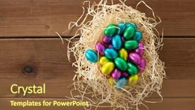  Presentation with confectionery - Amazing PPT layouts having chocolate eggs in foil wrapper backdrop and a tawny brown colored foreground