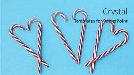  Presentation with cane - Presentation featuring christmas and winter holidays concept - candy cane decorations in shape of hearts on blue background background and a light blue colored foreground