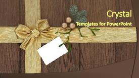  Presentation with oak - PPT theme featuring christmas background gold bow and ribbon with fir mistletoe and bauble decorations with gift tag over old oak background and a tawny brown colored foreground