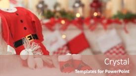  Presentation with baby christmas - Audience pleasing presentation consisting of christmas composition with santa claus outfit for baby on plaid at home backdrop and a coral colored foreground