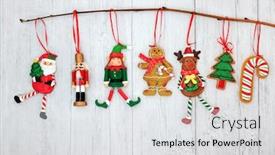  Presentation with elf - Presentation design consisting of christmas decorations hanging on a branch with santa claus elf gingerbread cookie nutcracker soldier tree candy cane and reindeer baubles on rustic wood background with copy space background and a light gray colored foreground