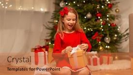  Presentation with christmas girl - Cool new presentation theme with christmas holidays and childhood concept - smiling girl in red dress with gift box at home backdrop and a coral colored foreground