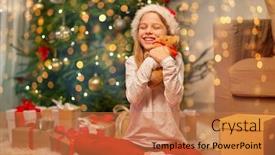  Presentation with christmas holidays - Slide deck having christmas holidays and childhood concept - smiling girl in santa helper hat with gift box and teddy bear at home background and a coral colored foreground
