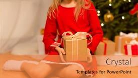  Presentation with christmas girl - Theme having christmas holidays and childhood concept - close up of girl in red dress with gift box at home background and a gold colored foreground