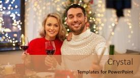  Presentation with christmas dinner - Presentation featuring christmas holidays technology and people concept - happy couple in taking picture by selfie stick at home dinner background and a coral colored foreground