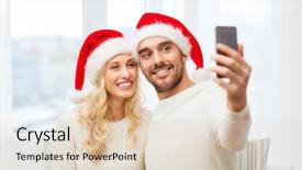  Presentation with christmas holidays - PPT theme enhanced with christmas holidays technology and people concept - happy couple in santa hats taking selfie picture with smartphone at home background and a lemonade colored foreground
