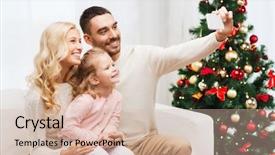  Presentation with happy holidays - Slide set with christmas holidays technology and people concept - happy family sitting on sofa and taking selfie picture with smartphone at home background and a soft green colored foreground
