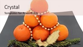  Presentation with cedar - Audience pleasing presentation theme consisting of christmas mandarin fruit draped in gold bead strand with golden holly and cedar leaf sprigs over white background backdrop and a lemonade colored foreground