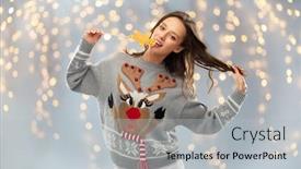  Presentation with ugly christmas sweater - PPT theme consisting of christmas people and holidays concept - happy young woman wearing jumper with reindeer pattern and biting gingerbread party accessory at ugly sweater party over festive lights background background and a light gray colored foreground
