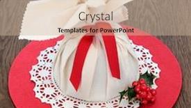  Presentation with christmas holly - Amazing presentation design having christmas pudding in muslin bag used for steaming with holly over oak background backdrop and a soft green colored foreground