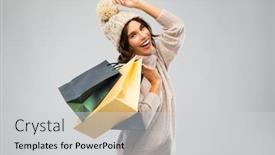 Presentation with consumerism - Beautiful slide deck featuring christmas seasonal sale and consumerism concept - happy smiling young woman in knitted winter hat and sweater with shopping bags over grey background backdrop and a light gray colored foreground