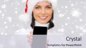 Presentation with gadget - Amazing PPT theme having christmas x-mas electronics and gadget concept - smiling woman in santa helper hat with blank screen smartphone backdrop and a light gray colored foreground