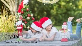  Presentation with summer christmas - Audience pleasing slides consisting of two child girls with chritmas backdrop and a light blue colored foreground