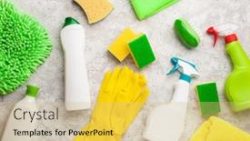  Presentation with household products - Audience pleasing PPT theme consisting of cleaning products household chemicals spray brush sponge glove backdrop and a yellow colored foreground