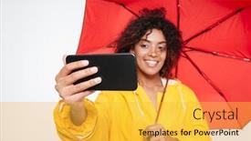  Presentation with under umbrella - Theme with close up image of smiling african woman in raincoat hiding under umbrella and making selfie on her smartphone over white background background and a yellow colored foreground