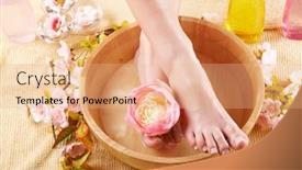  Presentation with fluid - Cool new presentation with close-up of beautiful female feet in wooden bowl filled with fluid cosmetics flowers all around concept of natural spa treatment backdrop and a coral colored foreground