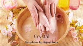  Presentation with cosmetics natural - Theme featuring close-up of beautiful female feet in wooden bowl filled with fluid cosmetics flowers all around concept of natural spa treatment background and a coral colored foreground