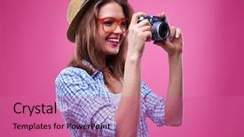  Presentation with lens - Cool new slide set with close-up of casual girl who is looking at lens of the camera while taking photo isolated over pink background in the studio with a copy space backdrop and a coral colored foreground