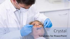  Presentation with dentist - Presentation theme consisting of close-up-of-dentist-examining background and a light blue colored foreground