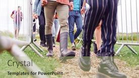  Presentation with music festival - Beautiful slide deck featuring close up of friends at entrance to music festival walking through security barriers backdrop and a mint green colored foreground