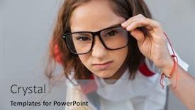  Presentation with eyeglasses - PPT theme with close up portrait of serious brunette schoolgirl in eyeglasses looking at the camera over gray background background and a light gray colored foreground