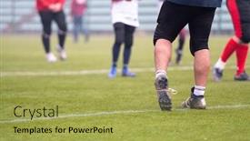  Presentation with football players field - Slide set featuring close up shot of group young professional american football players warming up and stretching together before a practice on the field focus on the legs background and a yellow colored foreground