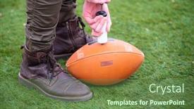  Presentation with football field - Cool new slides with close up shot of man on the field pumping air into a professional ball for american football backdrop and a tawny brown colored foreground
