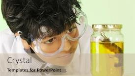  Presentation with mad scientist - PPT theme with closeup image of a young mad scientist checking out a jar containing a mouse specimen background and a mint green colored foreground