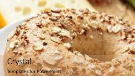  Presentation with bagel - Cool new presentation theme with closeup of a brown bagel topped with different seeds with a piece of cheese and some vegetables in the background backdrop and a coral colored foreground