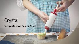  Presentation with cupcake - Colorful presentation design enhanced with closeup of a teenage cook garnishing a cupcake with some whipped cream backdrop and a light gray colored foreground