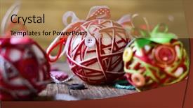  Presentation with strings - Audience pleasing presentation consisting of closeup of some handmade christmas balls made with ribbon bow strings and buttons of different colors on a rustic wooden surface backdrop and a coral colored foreground