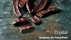  Presentation with carob - Presentation theme featuring closeup-of-some-ripe-carob background and a tawny brown colored foreground
