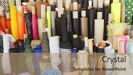  Presentation with fabric - Presentation theme consisting of closeup of various fabric bolts background and a coral colored foreground