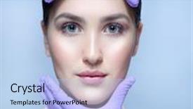  Presentation with skin care - Audience pleasing slide deck consisting of closeup portrait of attractive young caucasian woman brunette on blue background studio shot lips face head and shoulders skin care hands gloves lifting plastic backdrop and a light blue colored foreground