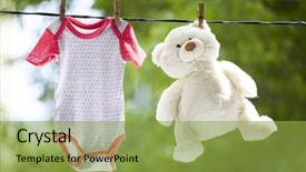  Presentation with baby clothes - Amazing PPT theme having clothes hanging on the clothesline backdrop and a yellow colored foreground