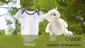  Presentation with baby clothes - Presentation featuring clothes hanging on the clothesline background and a gold colored foreground