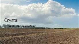  Presentation with stormy sky and dark clouds - Theme having clouds in sky over plowed field background and a light blue colored foreground