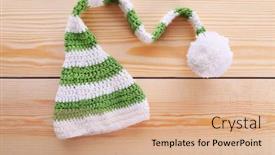  Presentation with baby color - PPT theme having color baby hat on wooden background background and a coral colored foreground