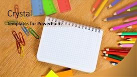  Presentation with colored pencils - PPT layouts enhanced with colored pencils and notepad on wooden table background and a gold colored foreground