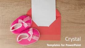  Presentation with congratulations baby - Audience pleasing presentation theme consisting of colorful-handmade-knitting-baby-shoes backdrop and a coral colored foreground