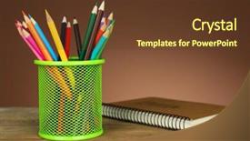  Presentation with green notebook - PPT theme featuring colorful pencils in green metal holder with notebook on wooden table and shaded color background background and a tawny brown colored foreground