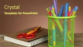  Presentation with green notebook - Presentation theme having colorful pens in green metal holder with notebook and scissors on wooden table and shaded color background background and a tawny brown colored foreground